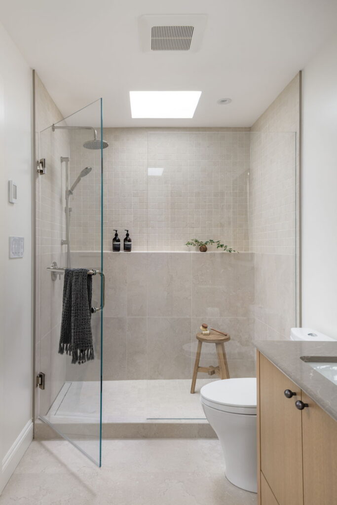 Spa inspired ensuite with glass shower and skylight